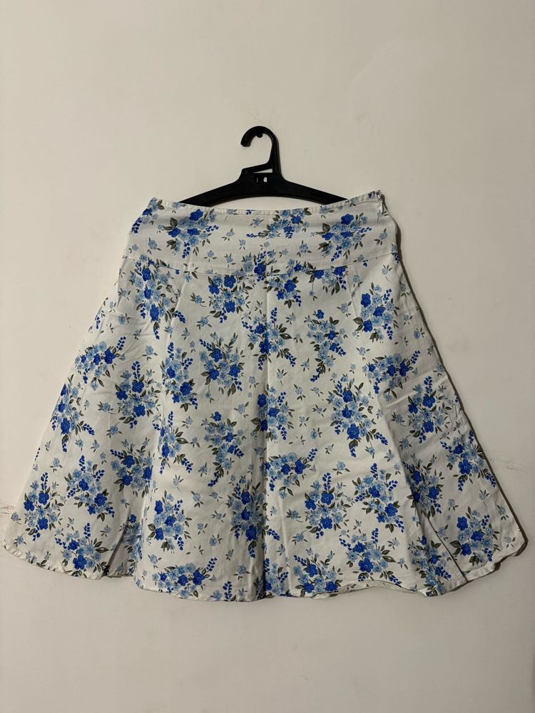 White skirt with a blue floral print