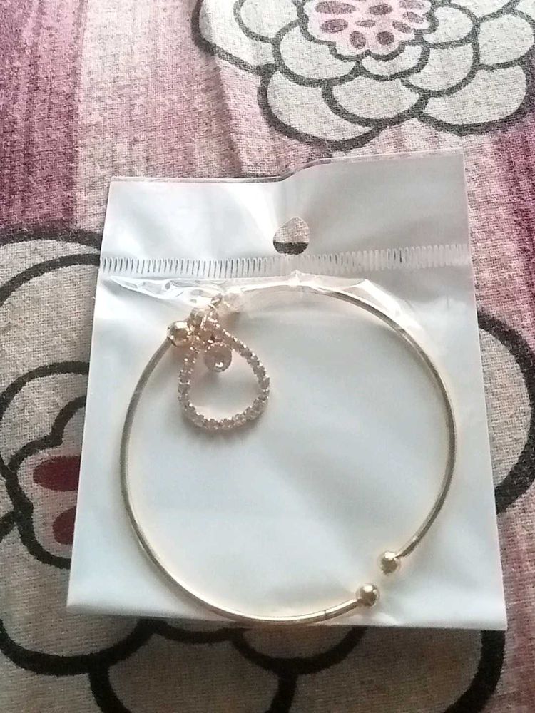 Gold Tone Bangle with Charm
