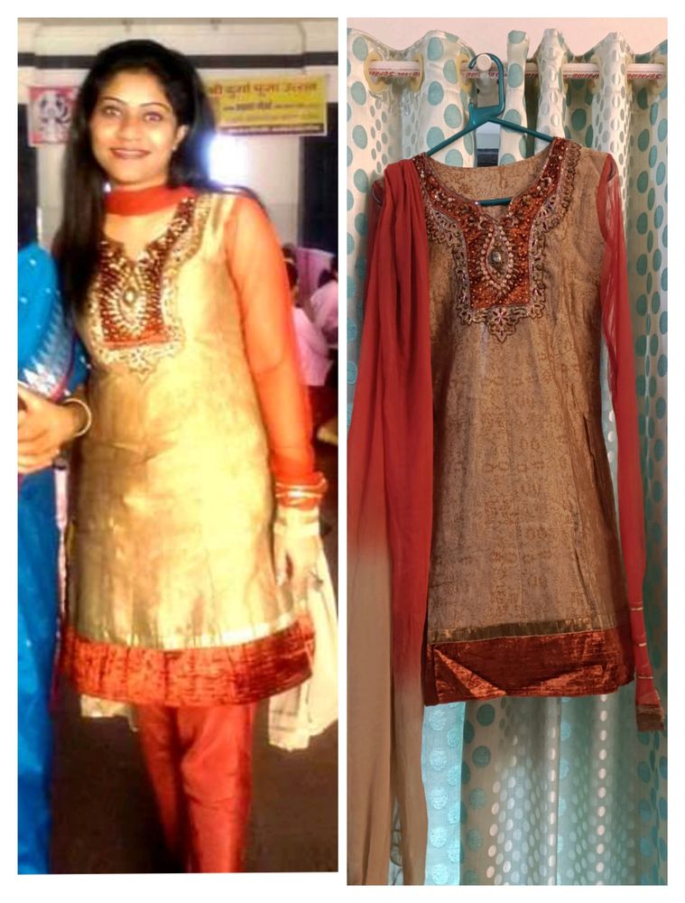 Heavy Designer Party Wear Golden Silk Printed Kurti With Churidar Net Sleeves , Full Lining And Velvet Border . Heavy Zardozi Embroidery On Front . Shaded Chiffon Dupatta With Gota. No Bottom.
