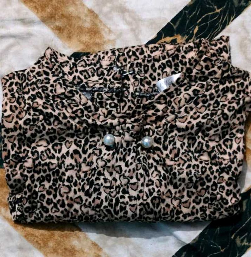 leopard-print top with pearl buttons