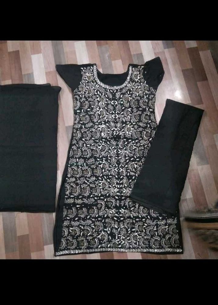 Black embellishments suit