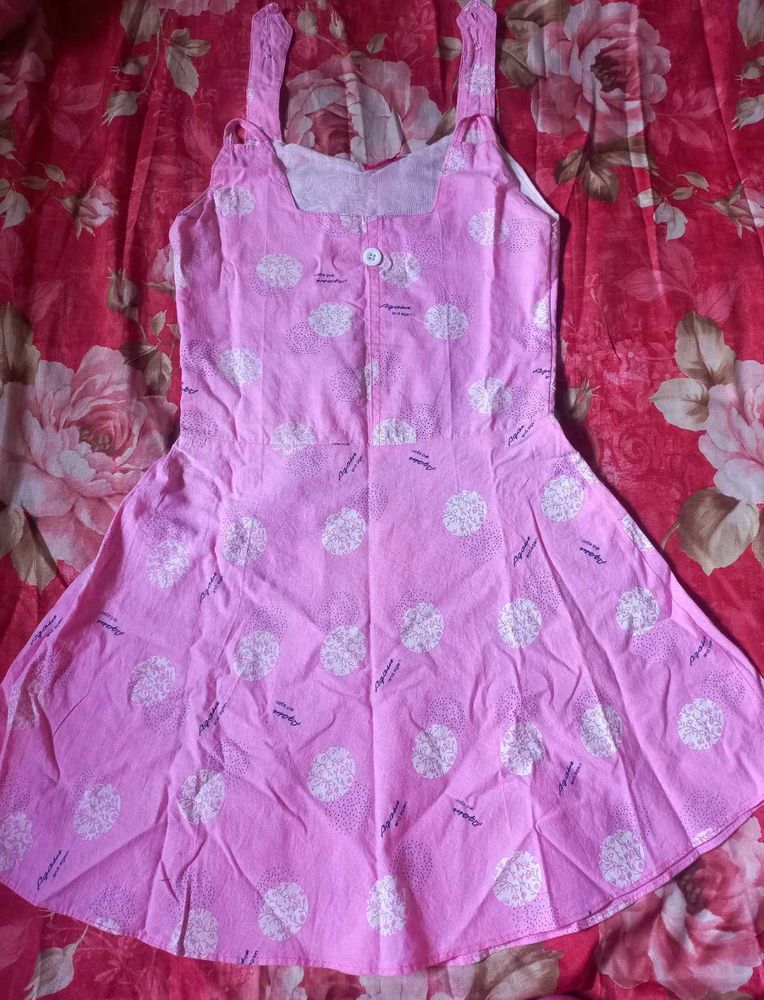 Pink Sundress with White Dot Pattern.