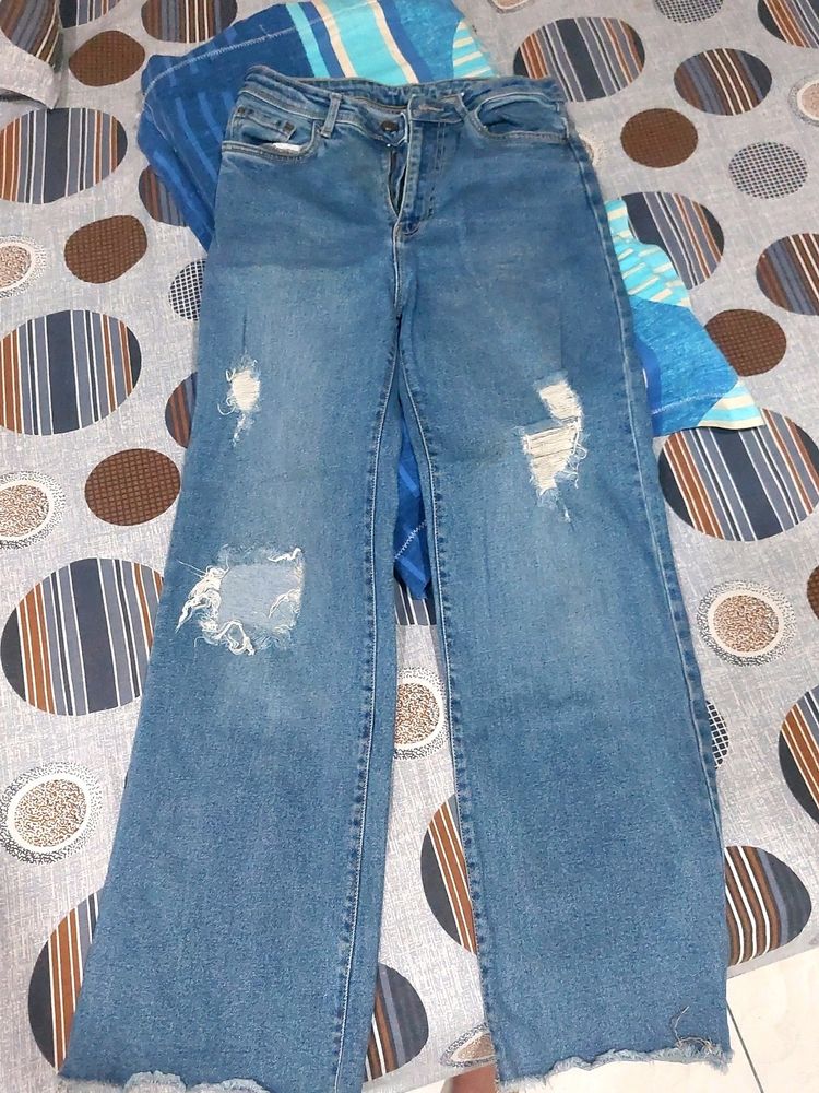 Ripped Blue Denim With Strechable Material .