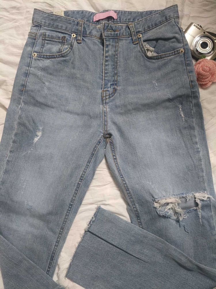 Ripped Light Wash Denim Jeans