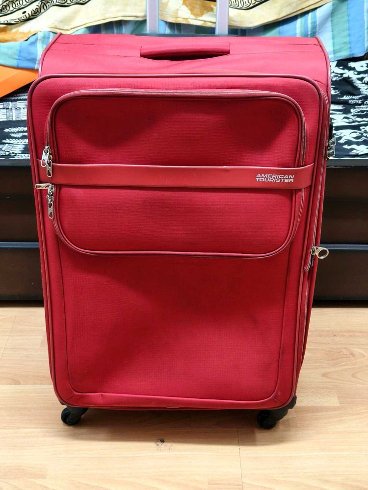 American Tourister Red DC Superlight Trolley Bag