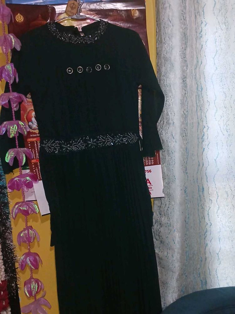 a green color gown having  modern look