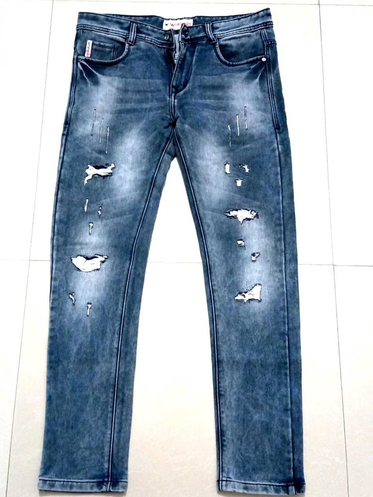 Ripped &amp; Distressed Slim Fit Jeans