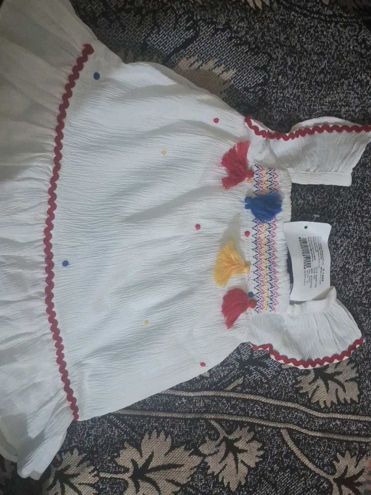 White Dress with Colorful Details