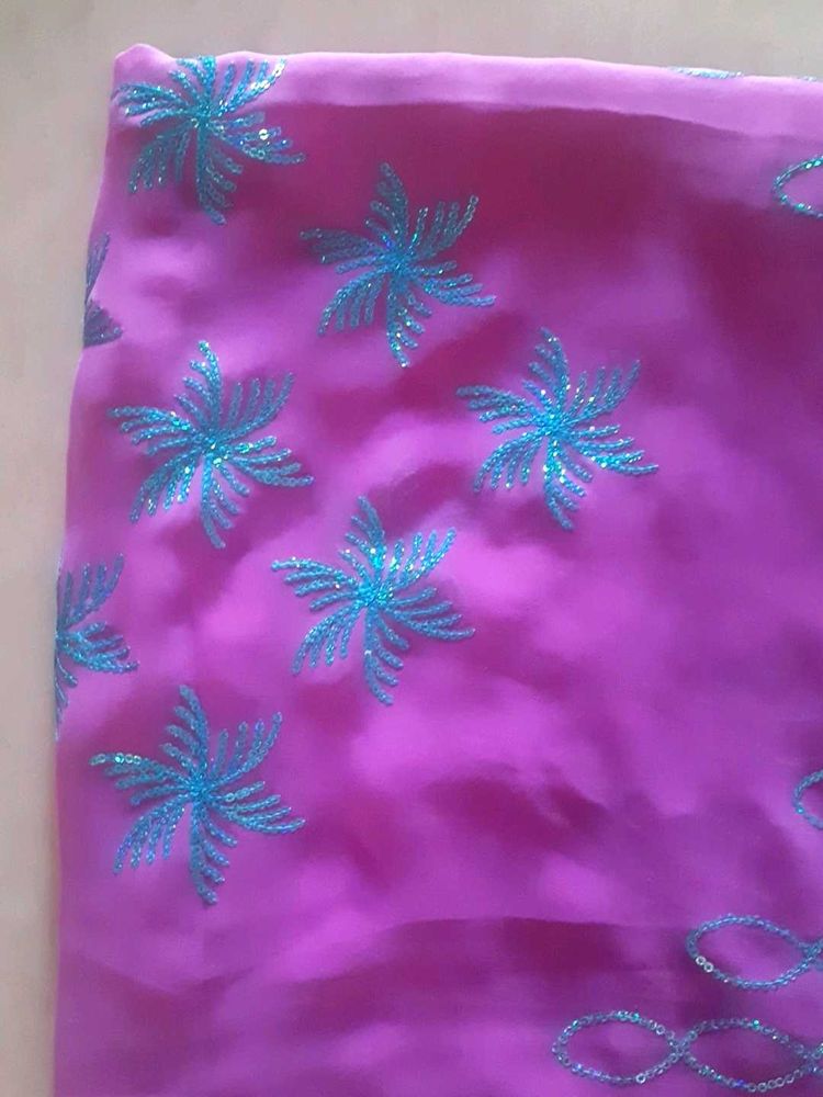 Ambroider saree with blouse.