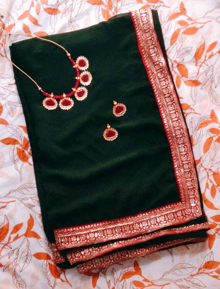 Elegant Green Saree with Pink Border