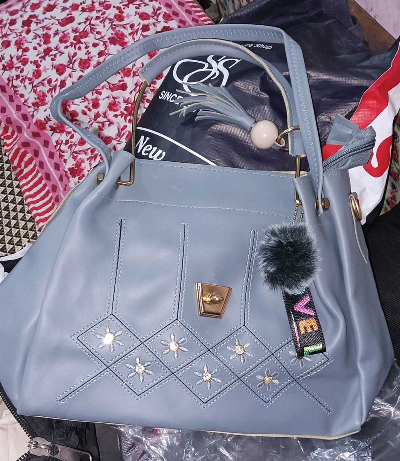 Stylish Blue Handbag with Charm