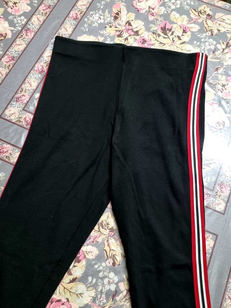 Striped Leggings with Red Accents
