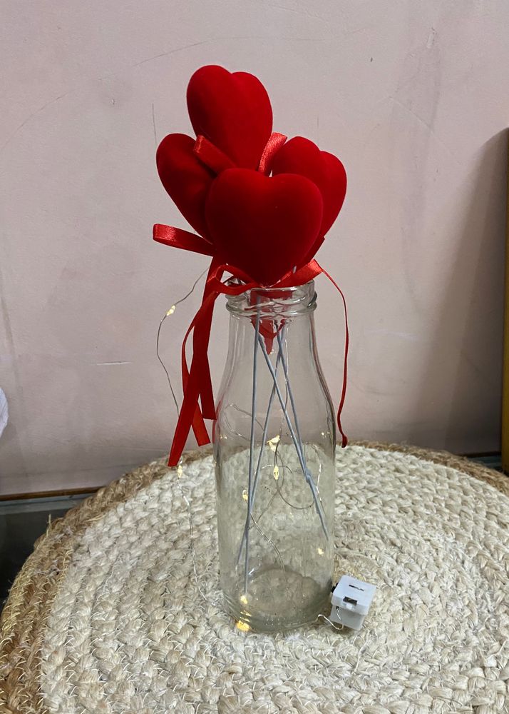 A Beautiful Glass Vase With 4 Heart  Stikes (17 C