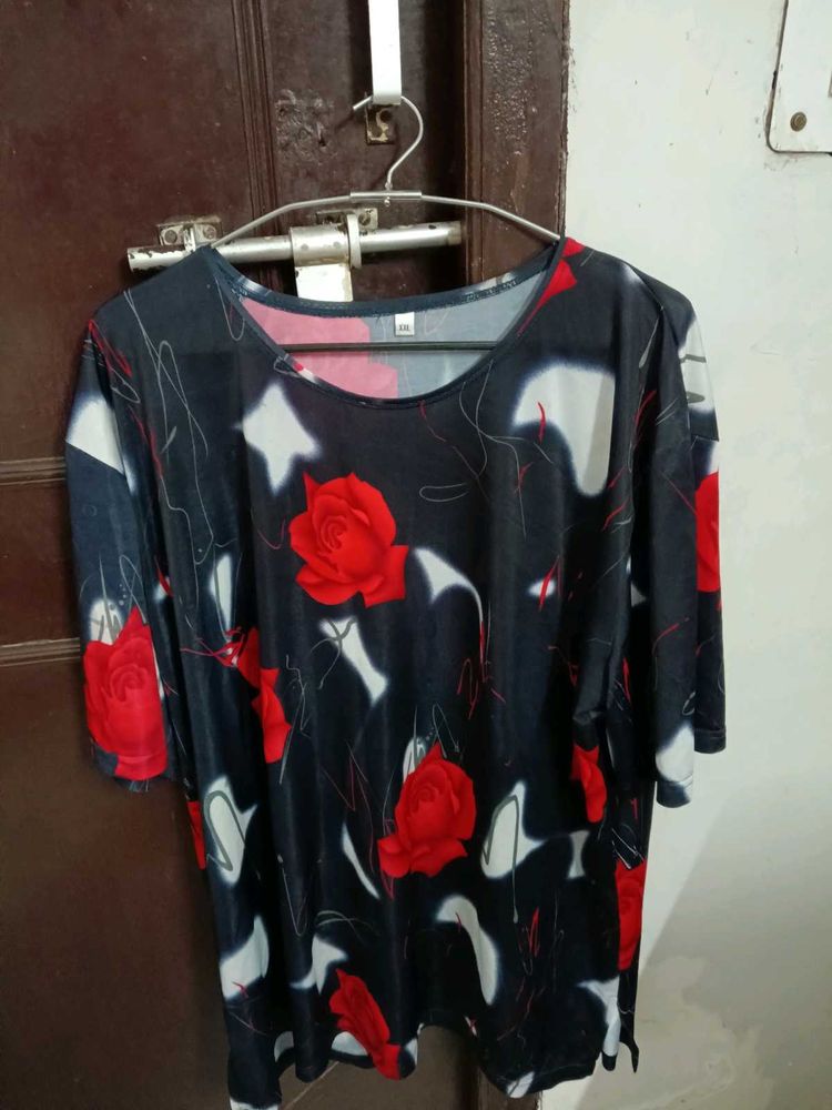 smart black top with red flowers on it