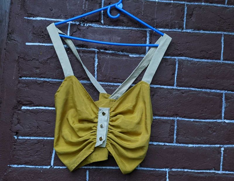 Hardly worn mustard yellow crop top .