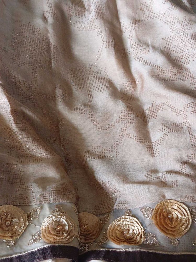 Elegant Beige Sari with Floral Border