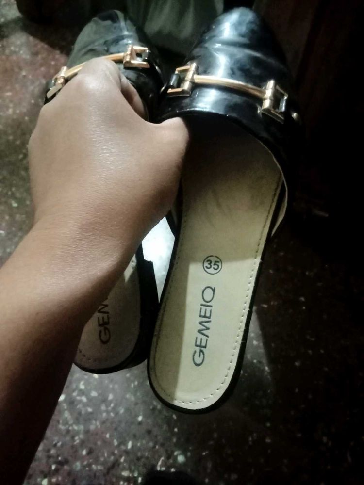 Black GEMEIQ Mules with Gold Accent