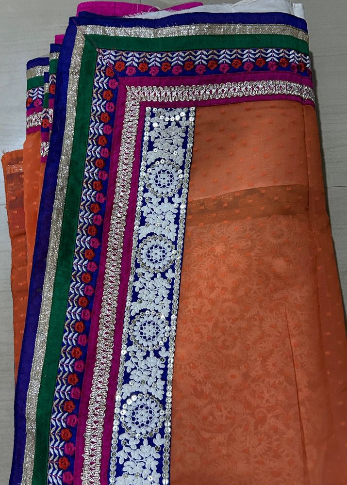 Orange Saree with Colorful Embellishments