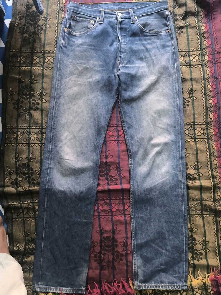 Worn Blue Denim Jeans