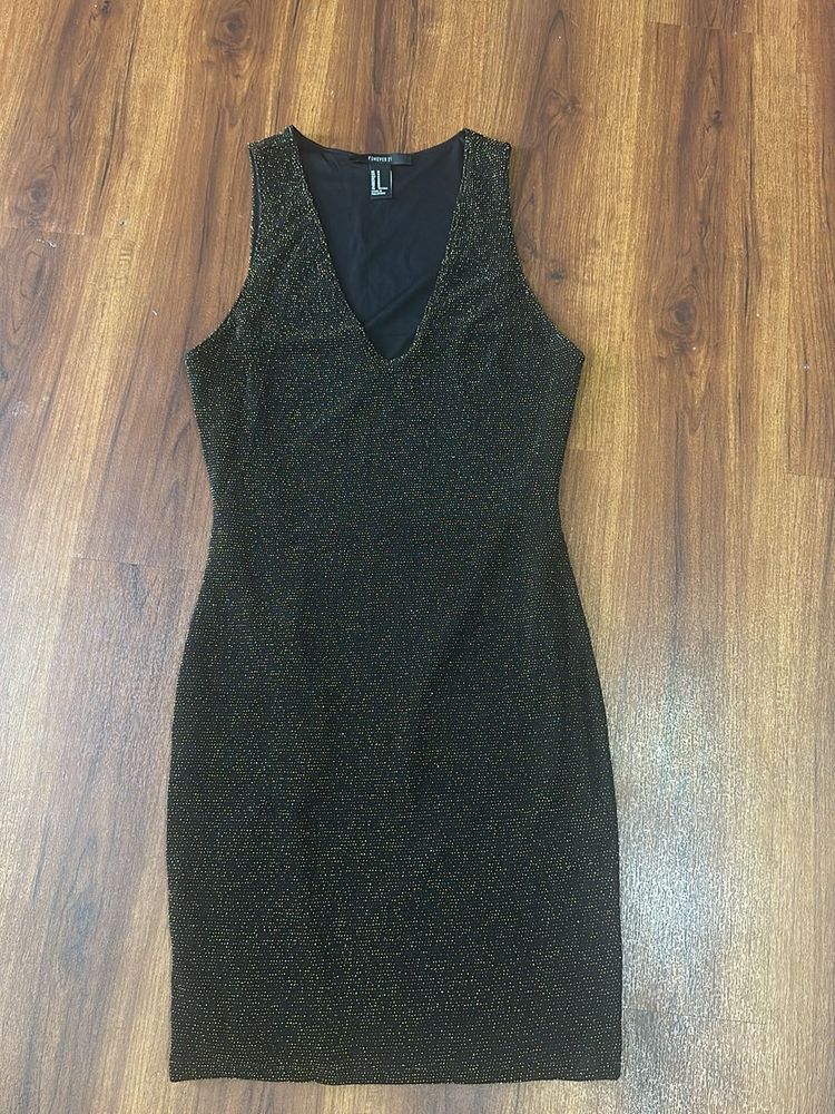 Black and golden shimmery dress in size M