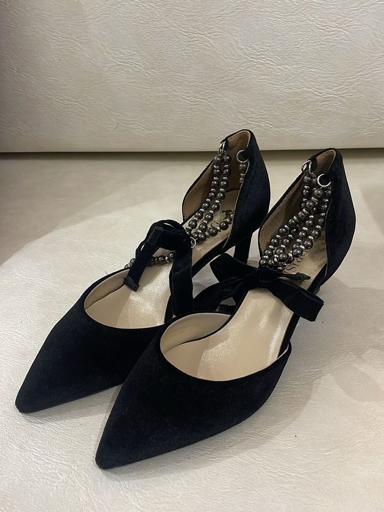 Black Heels with Silver Embellishments