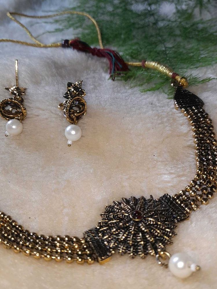 Neckpiece And Earpiece
