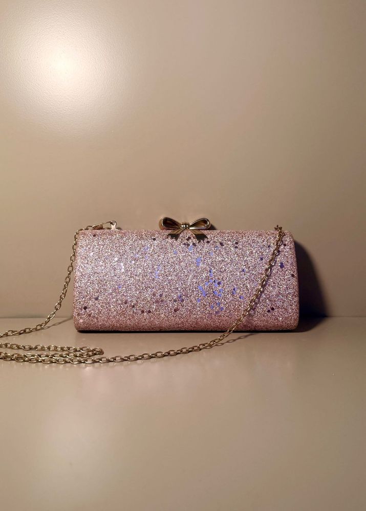 rose‑gold glitter box clutch with bow clasp, chain
