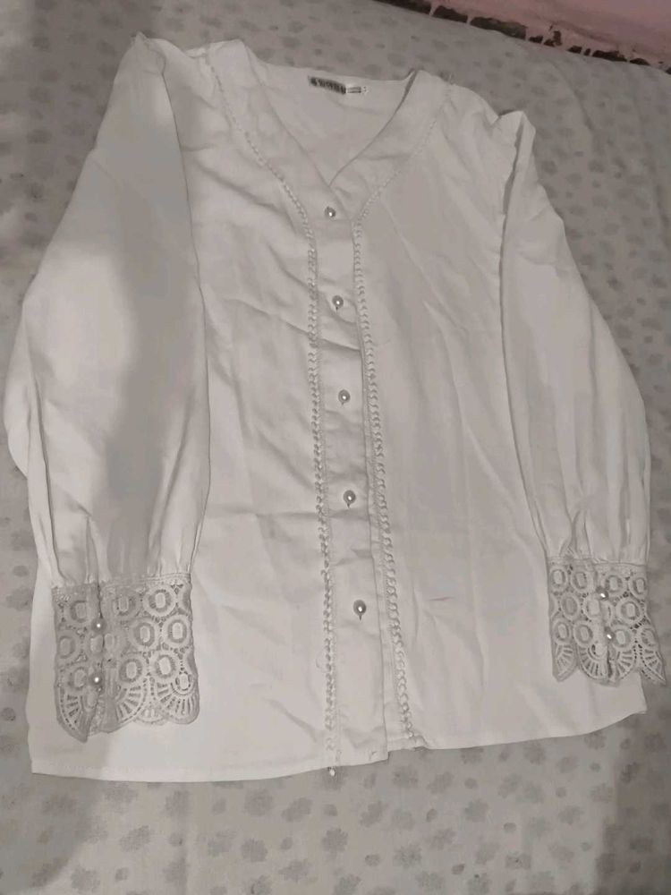 A White Shirt With Pearls