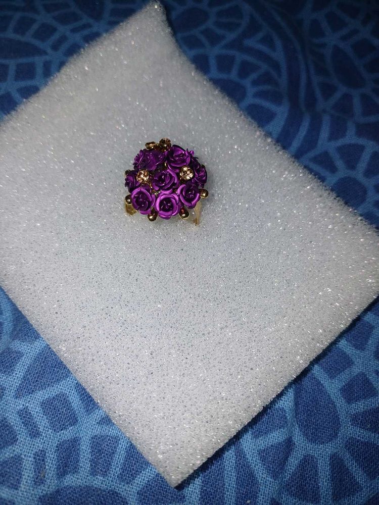 Vibrant purple rose cluster ring with golden Stone