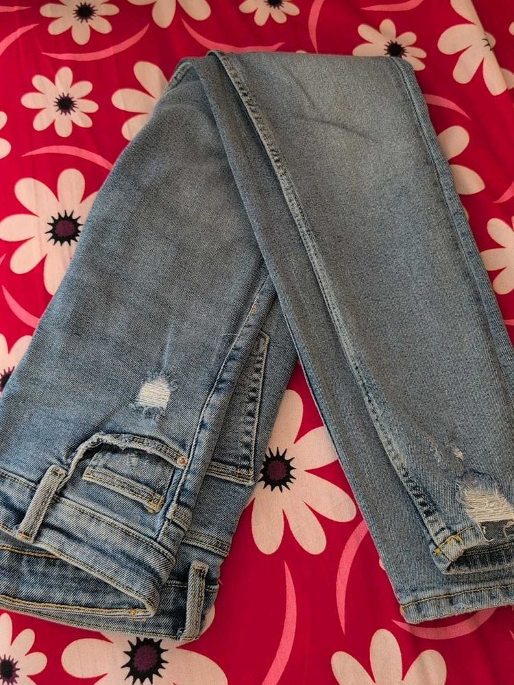 Distressed Light Wash Denim Jeans