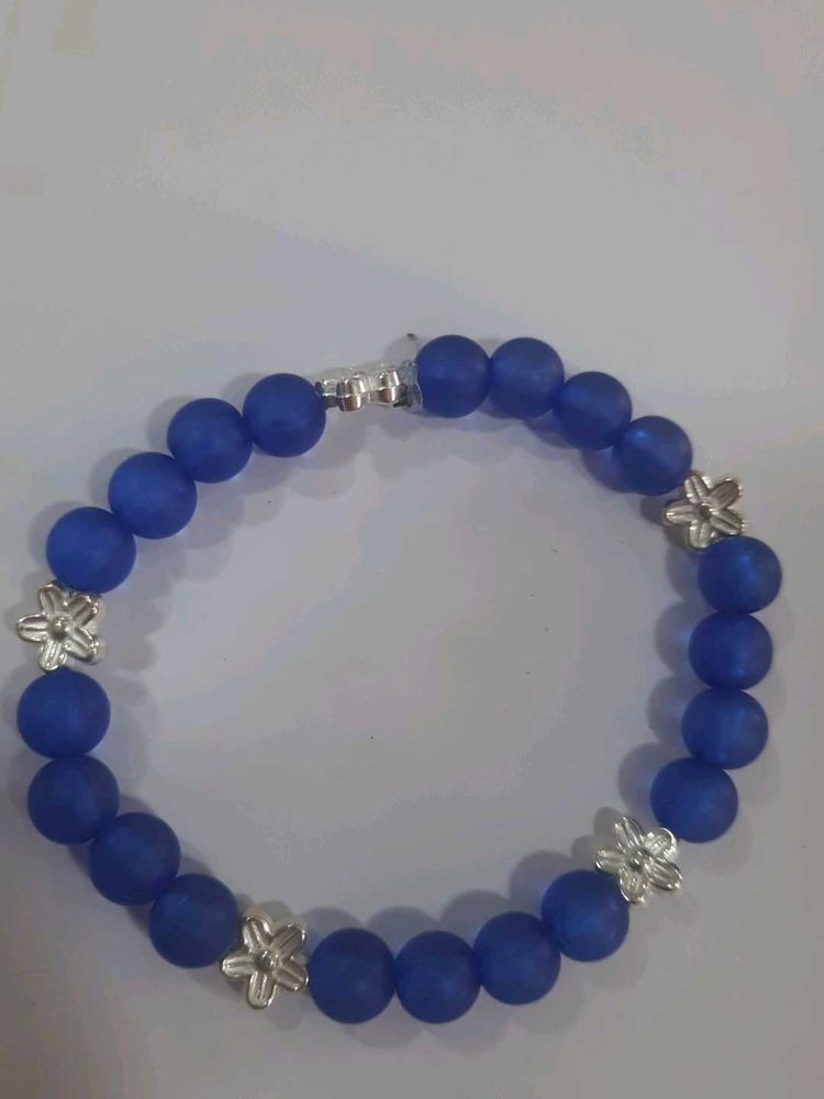 Blue Beaded Bracelet with Silver Flowers