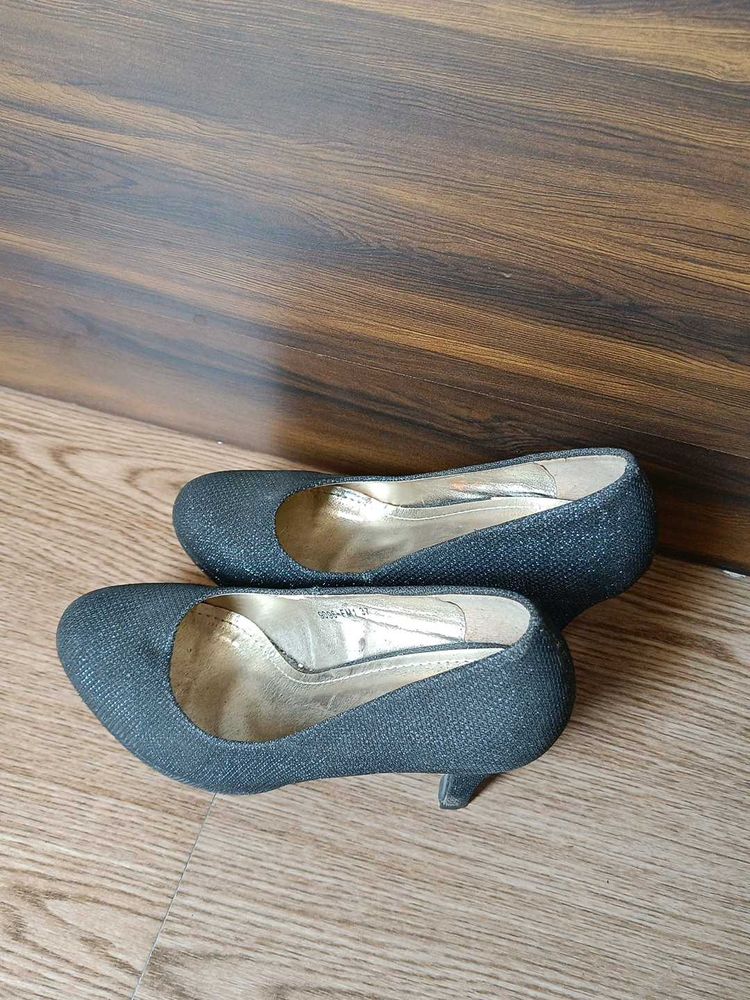 Black Heels And Yellow Flats