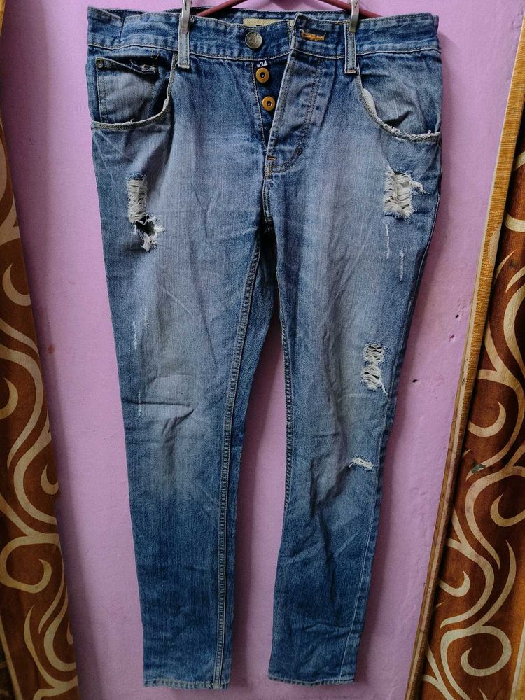 Ripped Blue Denim Jeans