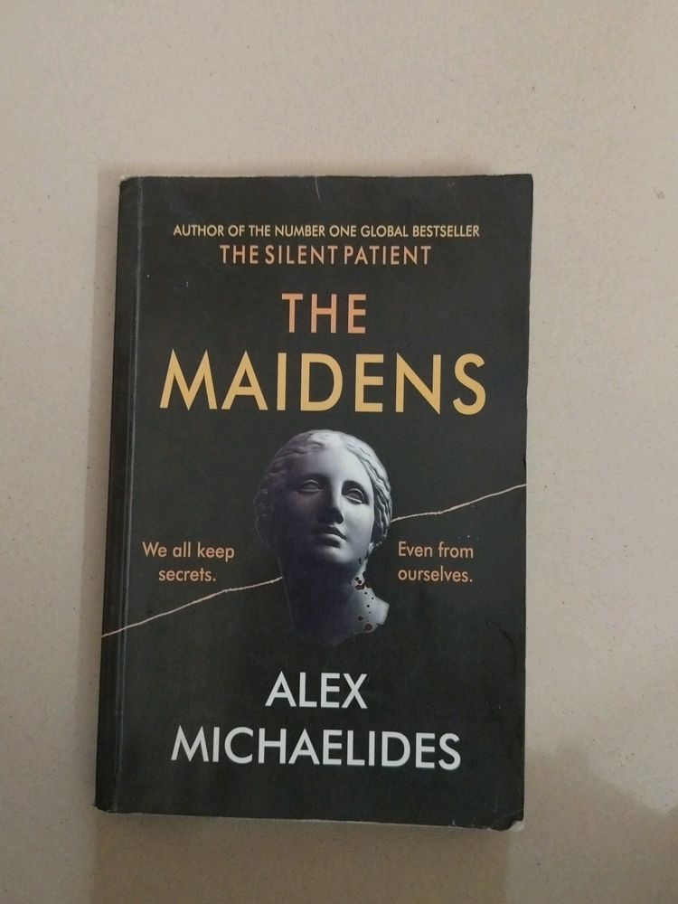 The Maidens by Alex Michaelides And notebook