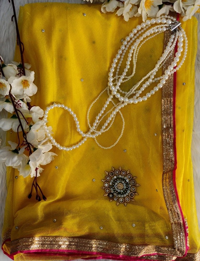 Elegant Yellow Saree with Pearl Details