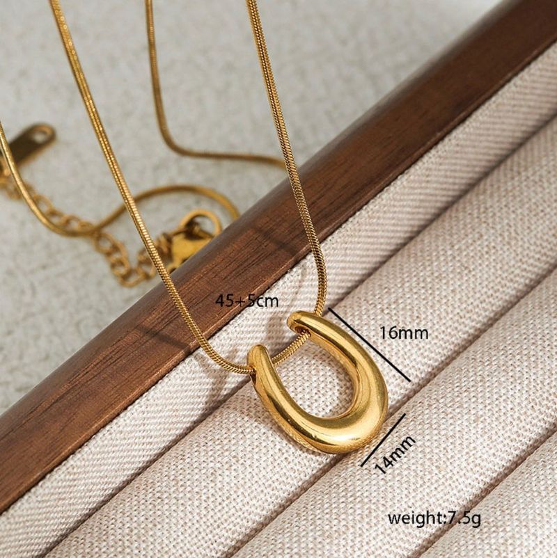 Gold Horseshoe Locket