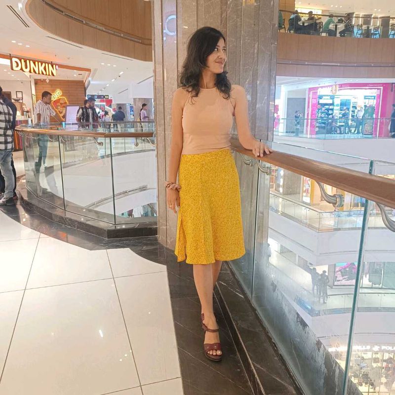 women floral printed high rise side slit skirt.