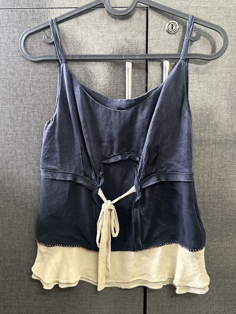 A Navy Blue &amp; Cream Coloured Tank Top.