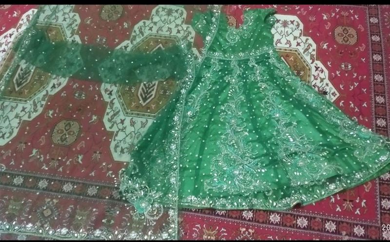 Parrot green Anarkali, chudidar n heavy duppata.