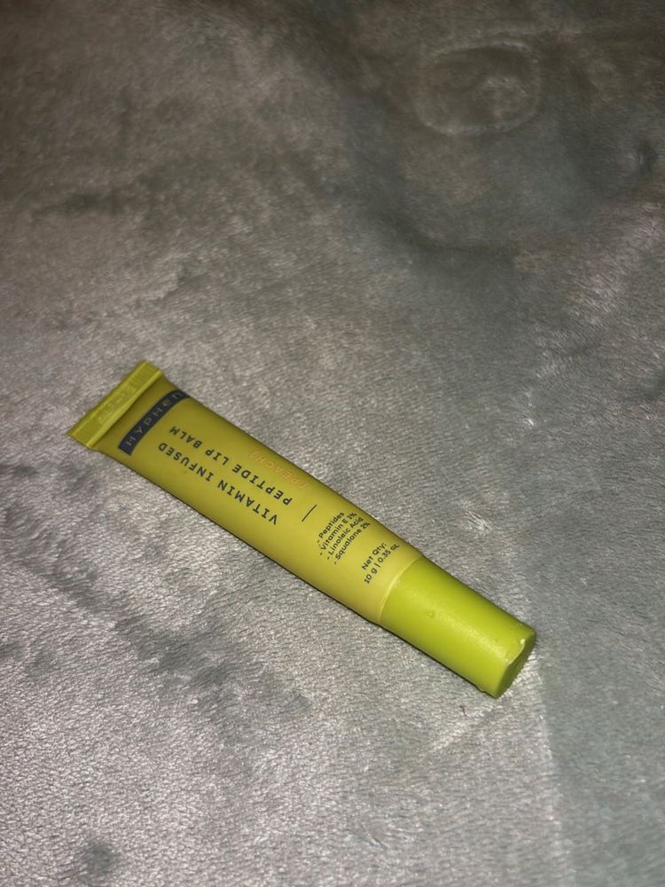 Vitamin infused peptide lip balm