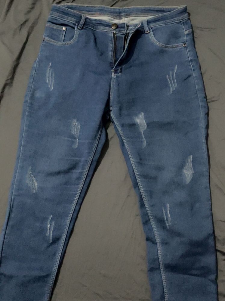 Distressed Blue Denim Jeans