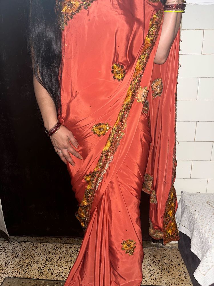 Elegant Orange Saree with Embellished Border