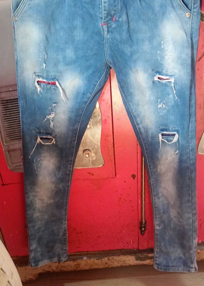 Distressed Blue Denim Jeans