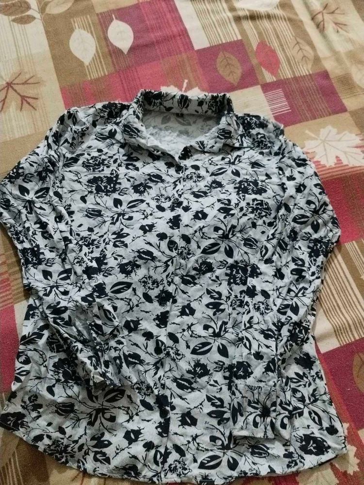 It Is A Shirt With Navy Blue Flowers