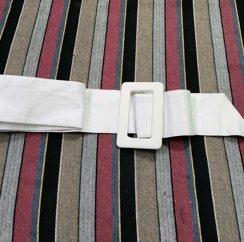 This is a very beautiful white colored cloth belt