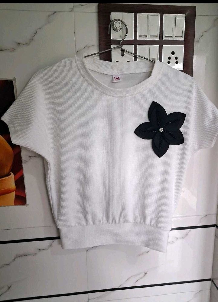 Girls Quilted t shirt with a black flower