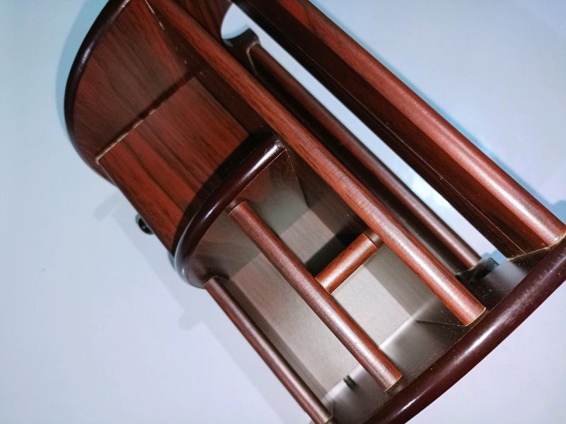 A wooden makeup or pen stand
