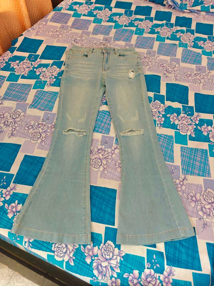 Ripped Bell Bottom Denim Jeans