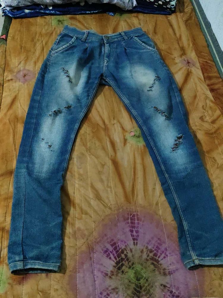 Ripped Blue Denim Jeans