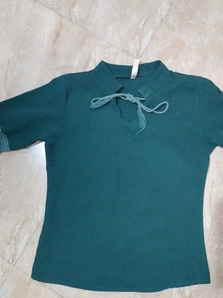 A dark green , full sleeve top